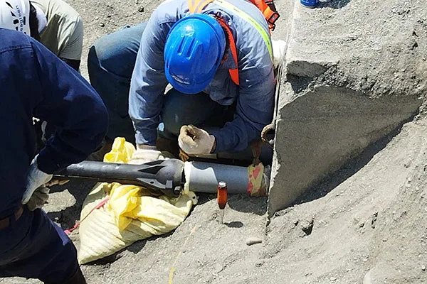Submarine cable engineer inspecting fiber-optic conduit